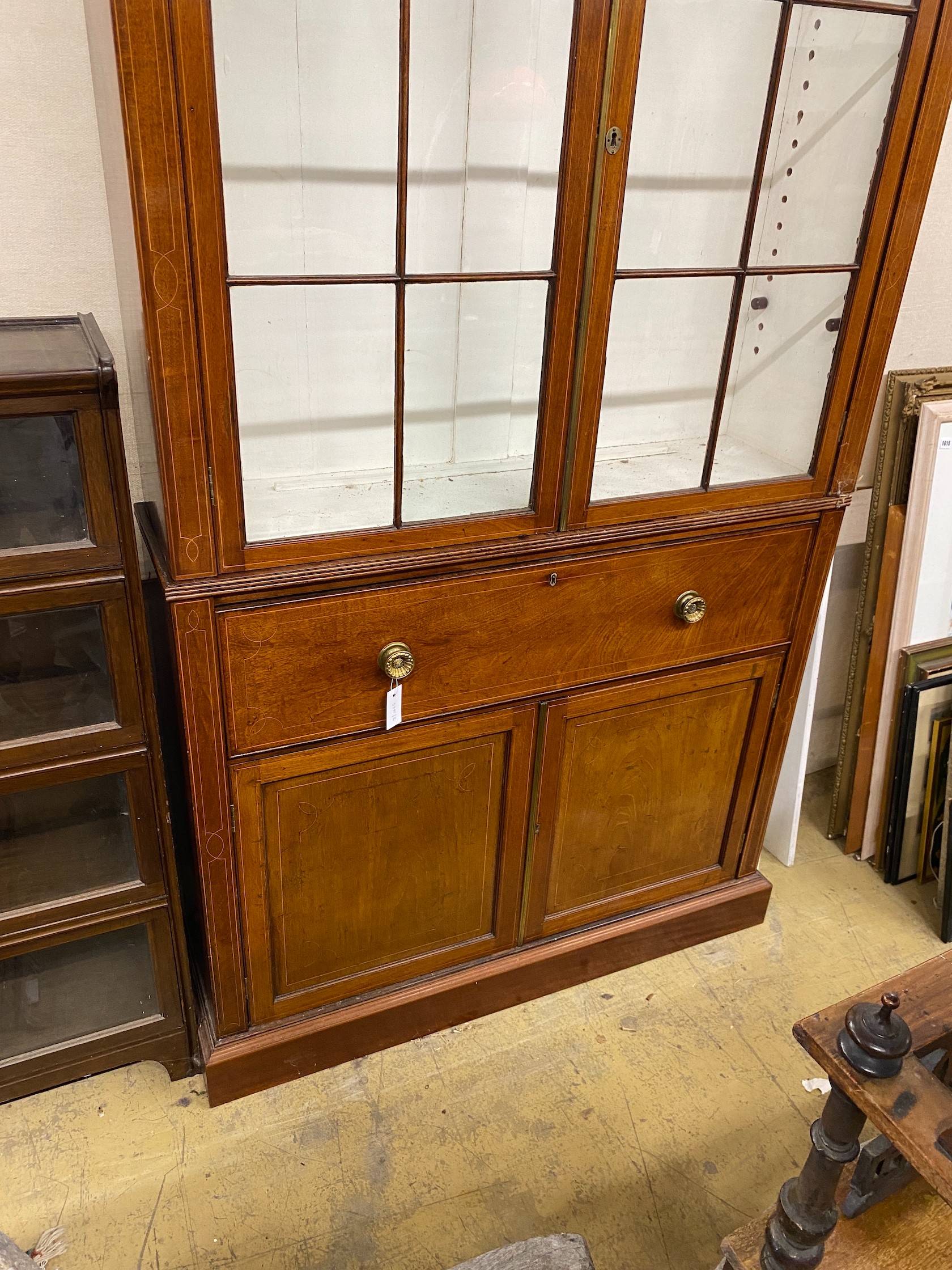 A George III mahogany secretaire bookcase, length 122cm, depth 33cm, height 232cm